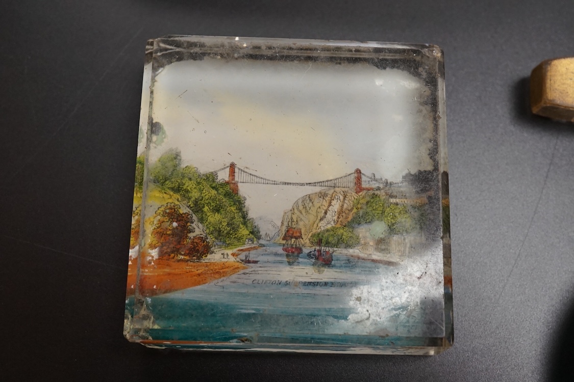 Six pictorial glass gem paperweights and three 19th century scent bottles, largest 11cm in length